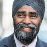 How can Trudeau allow Sajjan to remain in cabinet?